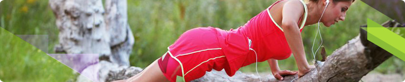 Woman performing press-ups outdoors