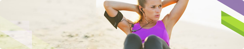 Woman performing crunch on beech 