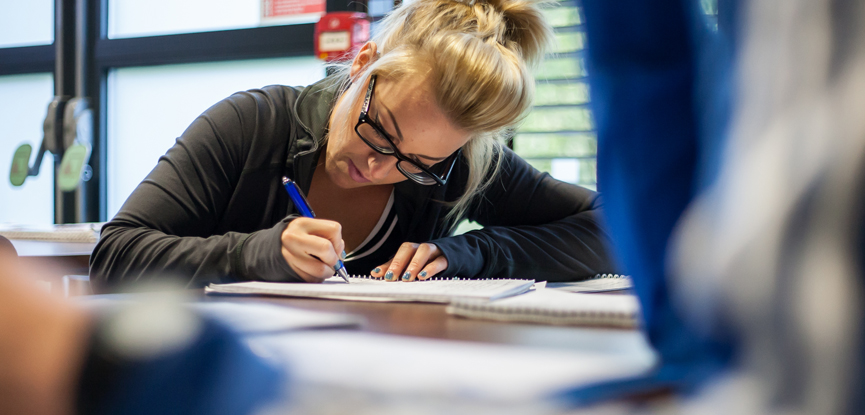 A student studying for her fitness qualification