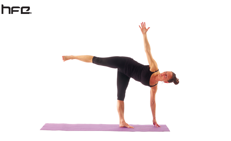 Female performing a half moon yoga pose for low back pain