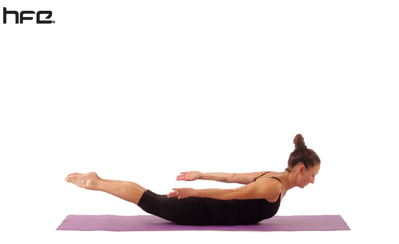 Female performing a locust yoga pose for low back pain