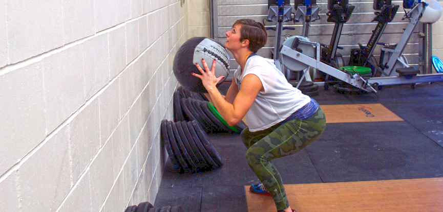 Georgina demonstrating a rotational wall ball slam