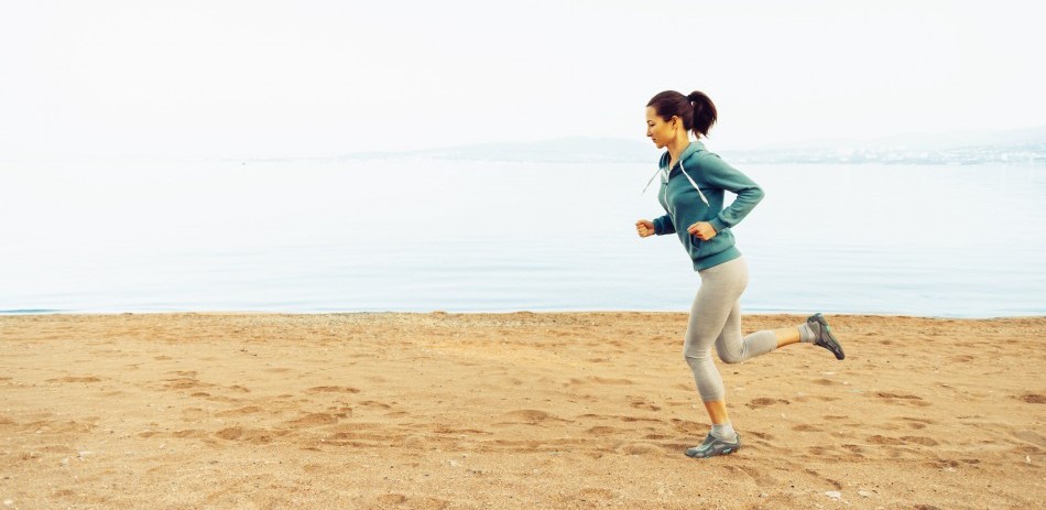 A female runner on a beach