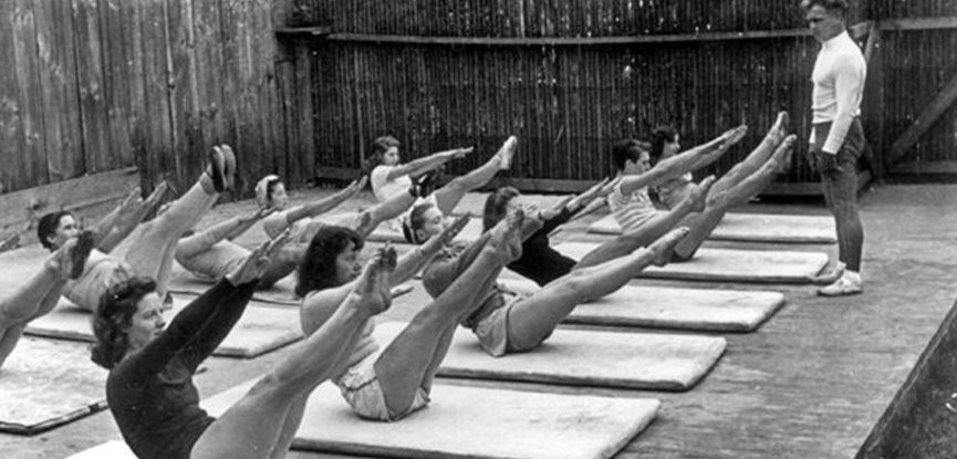 Joseph Pilates resides over a mat-based Contrology class