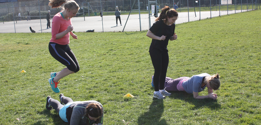 Jumping exercises at an outdoor bootcamp