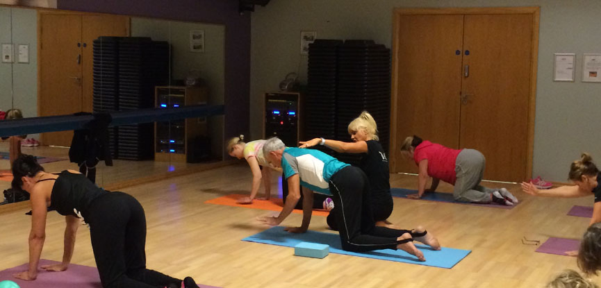 Ruth Hoyle, certified Pilates instructor teaching a class