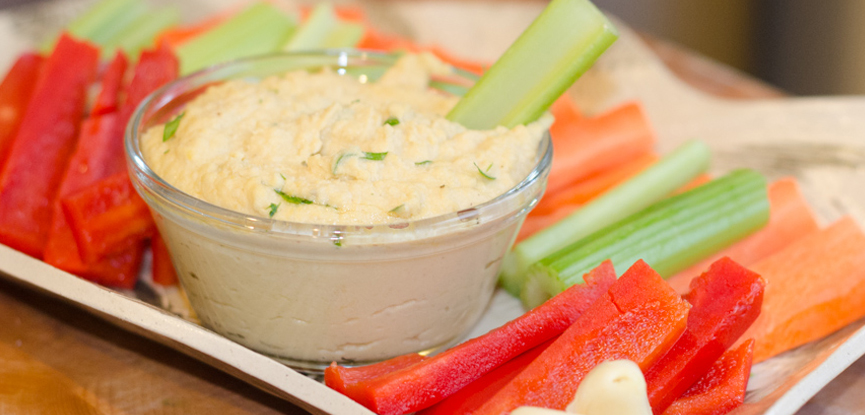 A selection of fresh vegatables served with houmous