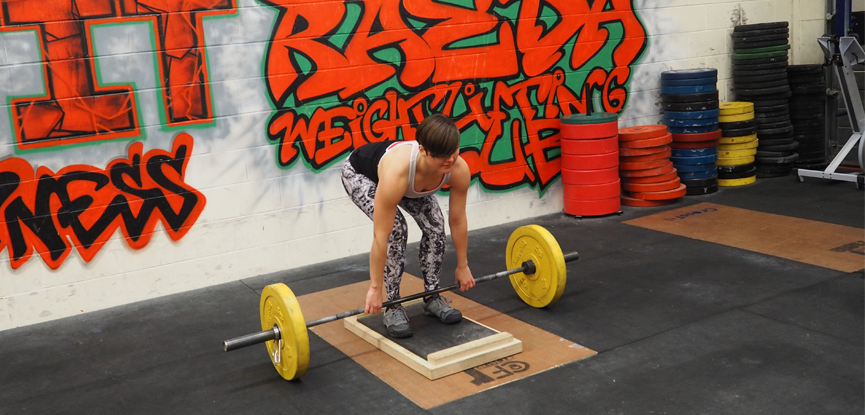 Fitness blogger Fitcetera demonstrates how to perform a deficit deadlift