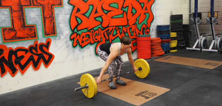 Georgina correctly performs a snatch grip deadlift