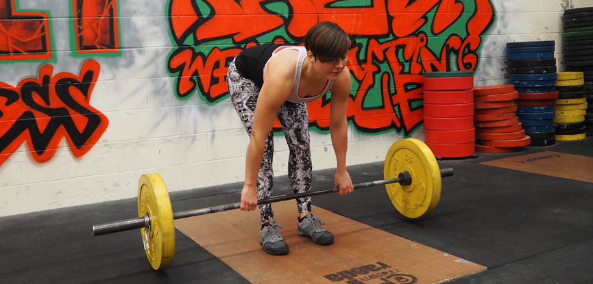 Fitness blogger Georgina demonstrates a stiff-legged deadlift