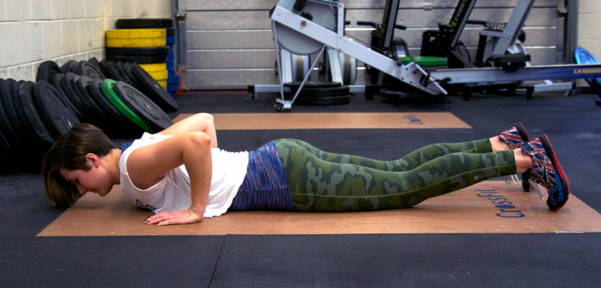 Personal trainer Georgina demonstrating a variation of the burpee