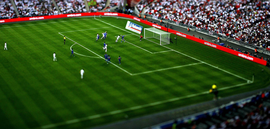 tilt shift image of a football match