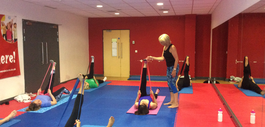 HFE graduate Maureen teaching a Pilates class