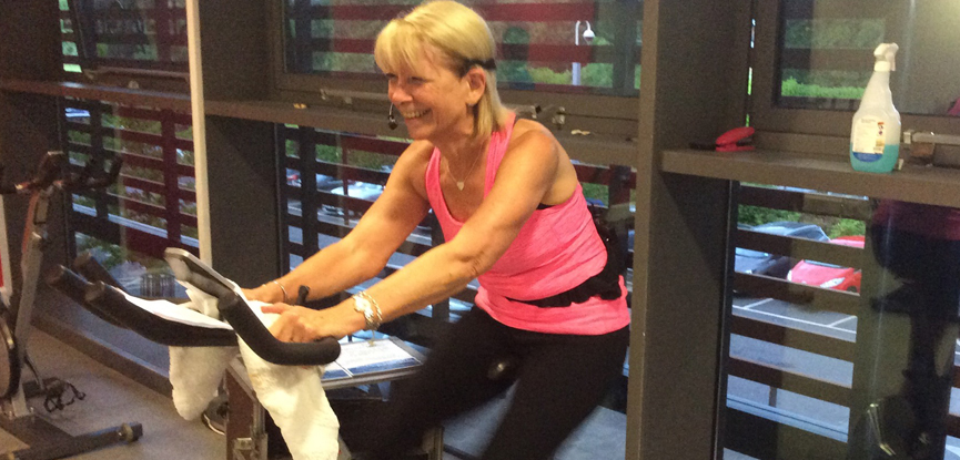 HFE student Maureen teaching a spinning class