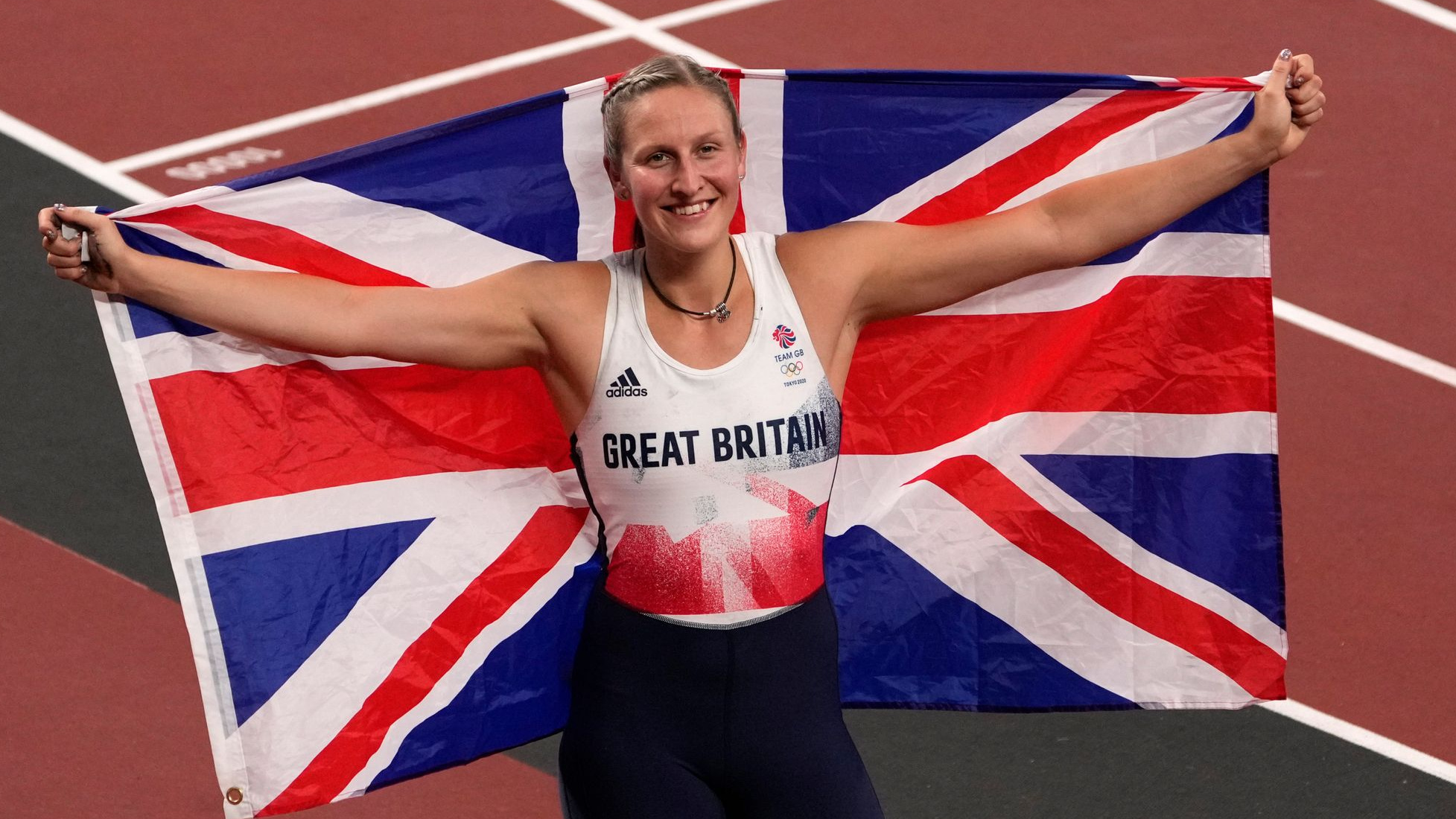 HFE graduate Holly Bradshaw holding GB flag at Olympics
