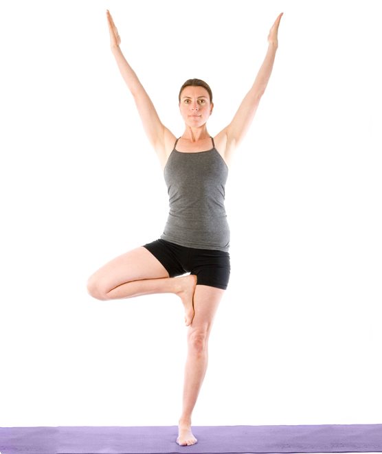 Sally Parkes performing a tree pose which aides healthy knees