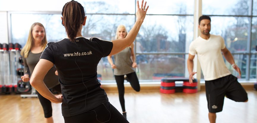 An instructor delivering an exercise to music class