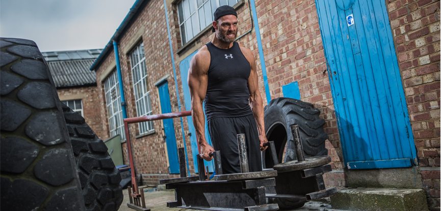 James Crossley performing a farmer's walk