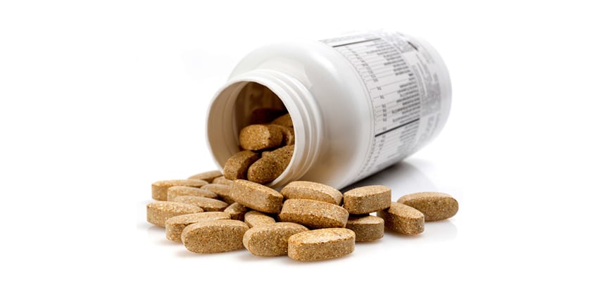 supplements bottle with tablets