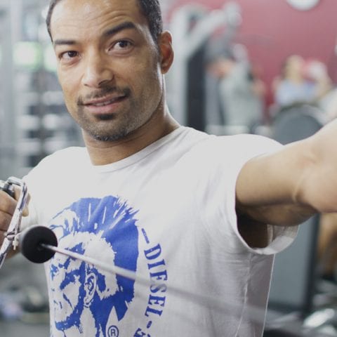 Personal trainer working with a client