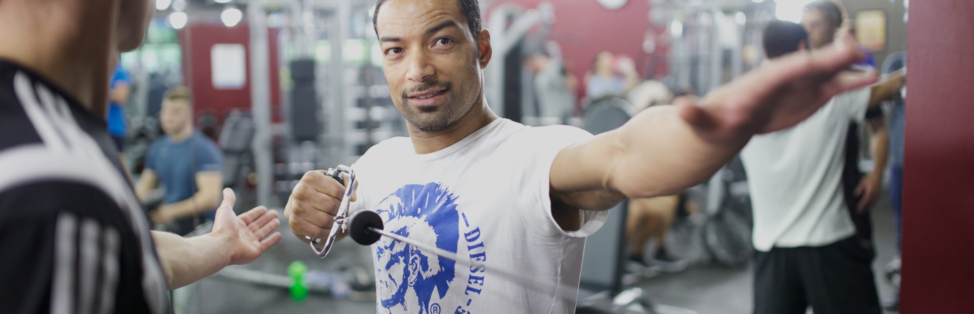 Personal trainer working with a client