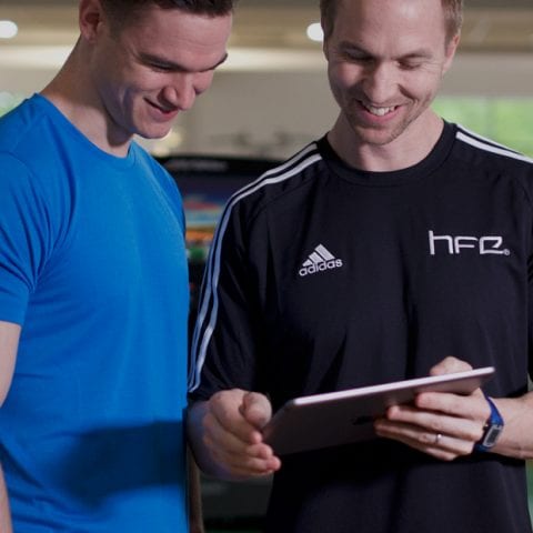 HFE tutor showing a student a digital version of a manual