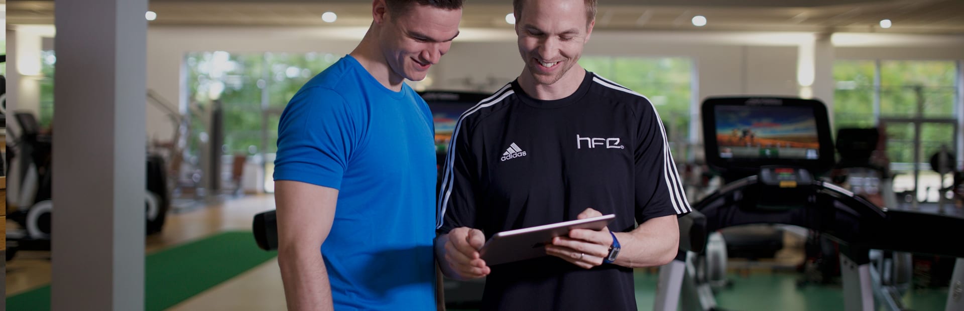 HFE tutor showing a student a digital version of a manual