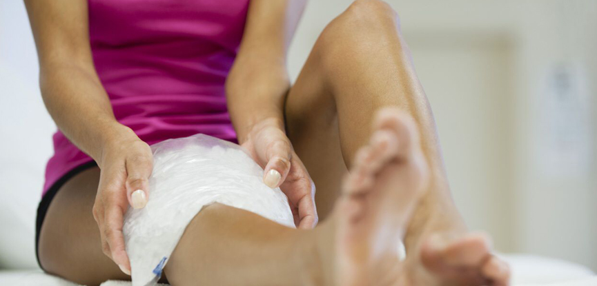 Applying ice to an injury to combat inflammation