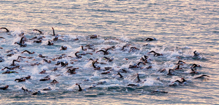 Athletes competing in the swim phase of the Ironman