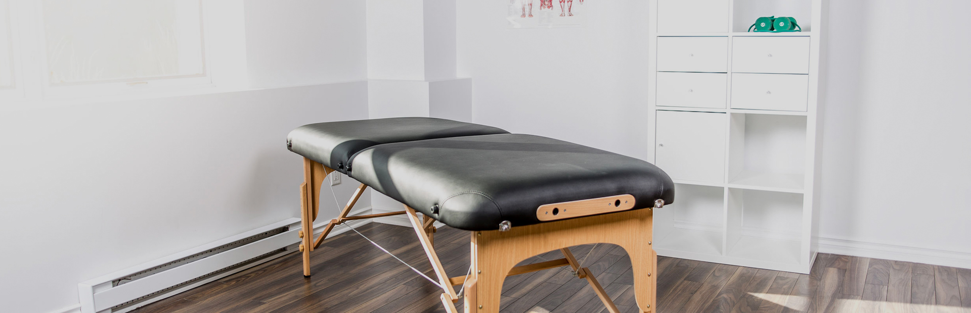 Massage therapy studio with a massage bed