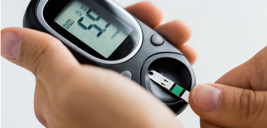 person taking blood glucose measurement