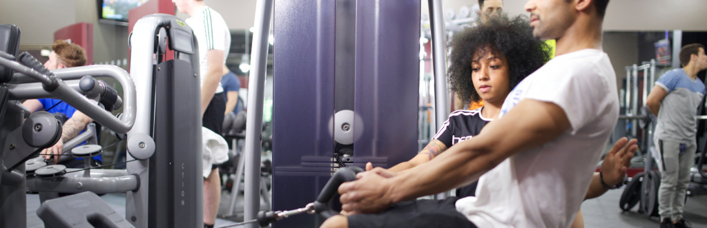 Employed personal trainer working at a Village Gym