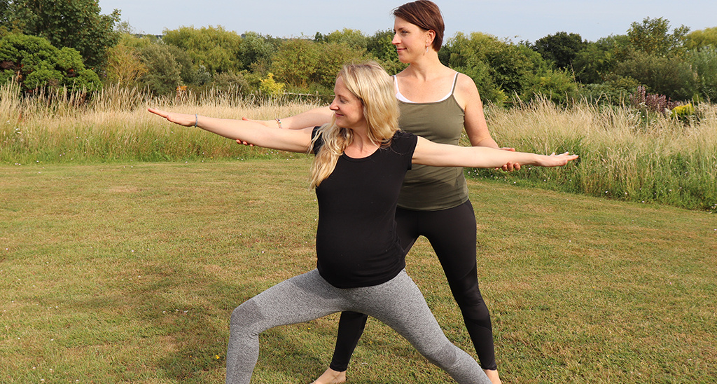 Yoga teacher Sally Parkes teaching a student