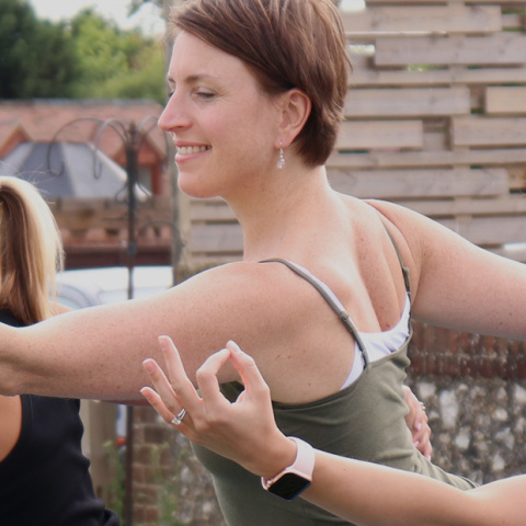 Yoga teacher Sally Parkes teaching yoga at a retreat