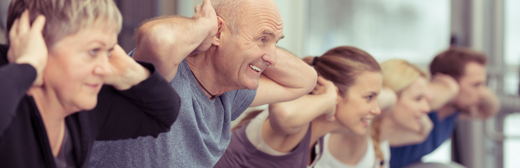 Older adults taking part in a group exercise class