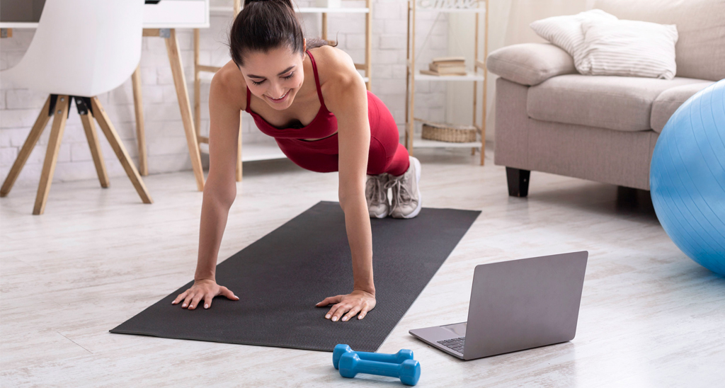 Female PT client performing a plank