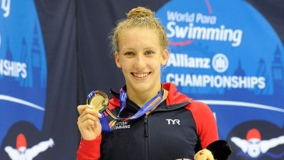 HFE student Louise Fiddes holding gold medal