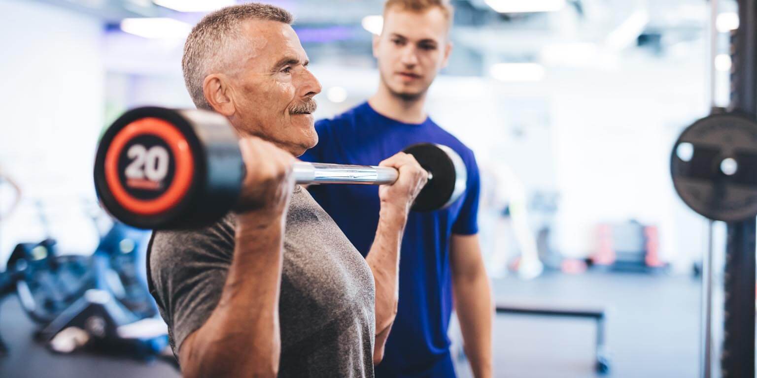 personal trainer working with client 