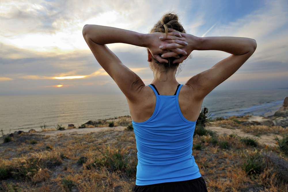 Woman on a beach exercising