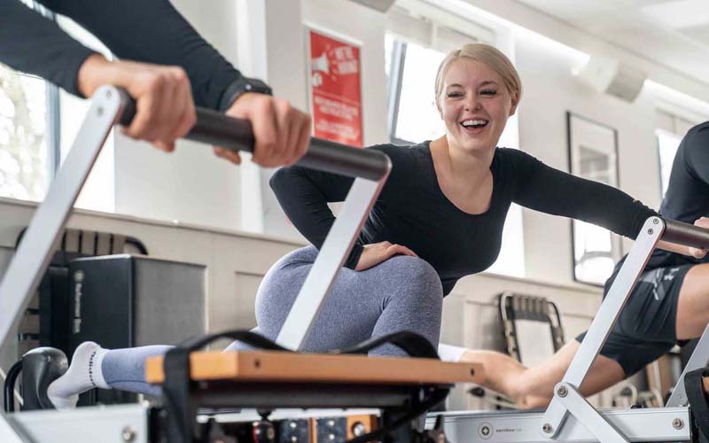 Pilates student on reformer