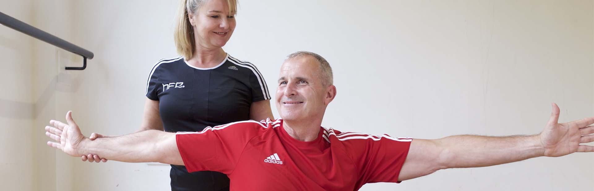 HFE Pilates instructor directing older adult in class