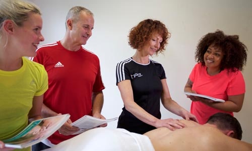 HFE tutor teaching sports massage