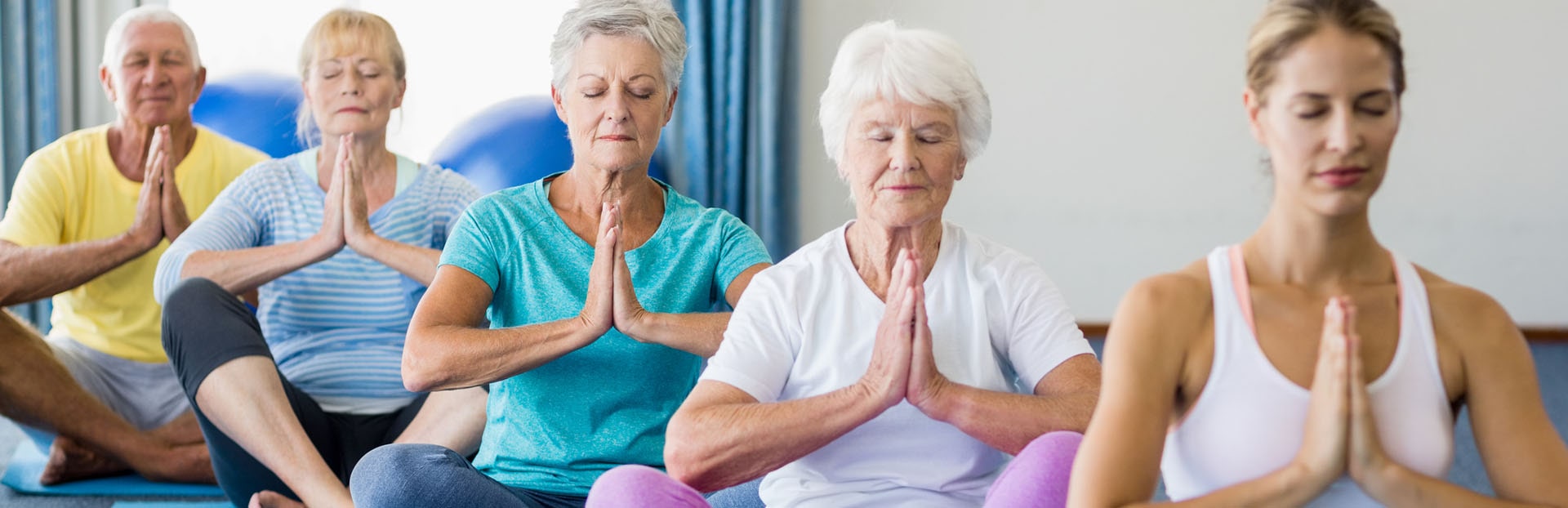 older adults performing Yoga