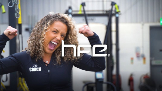 sport nutrition coach smiling behind HFE logo overlay