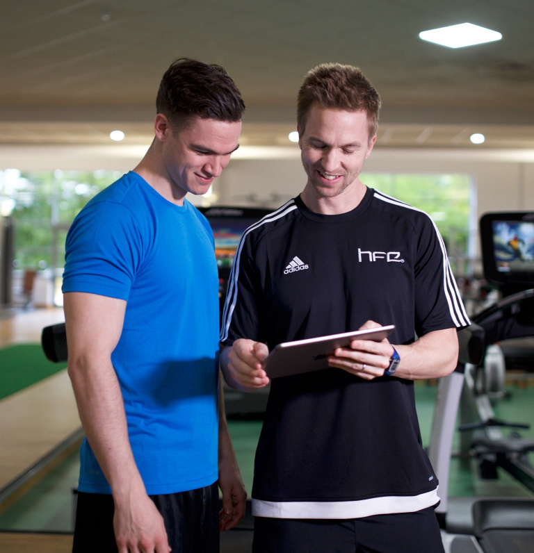 HFE tutor with client in gym