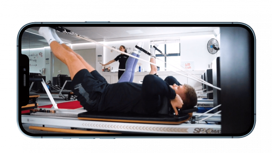 reformer Pilates course shown on iPhone screen