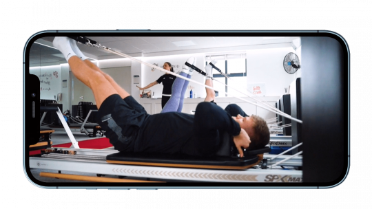 reformer Pilates course shown on iPhone screen