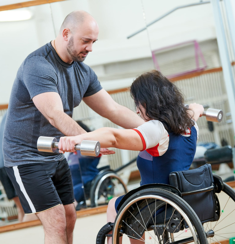 woman in wheelchair in gym