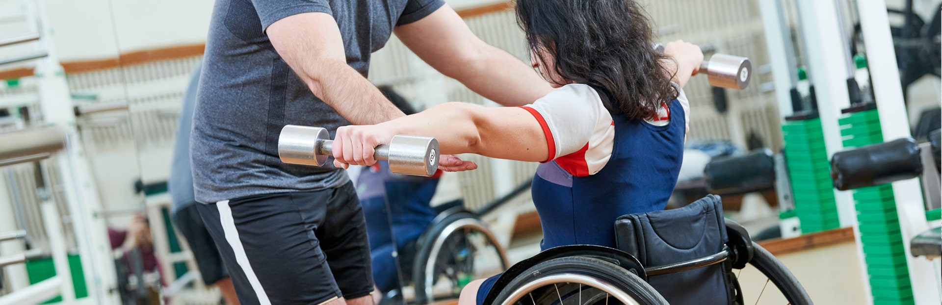 woman in wheelchair in gym