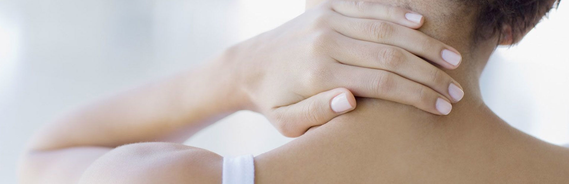 woman with sore neck and shoulder